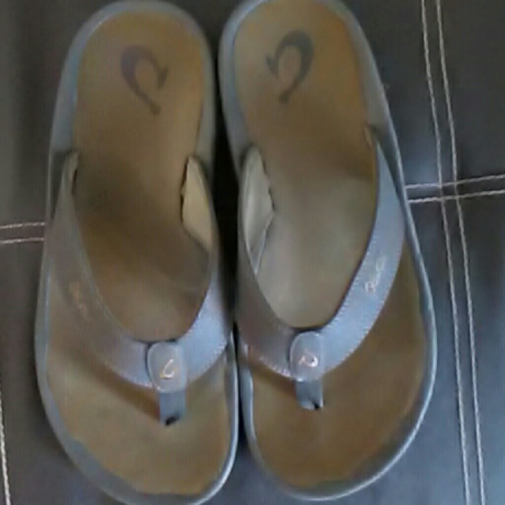 Men's brown Olukai flip flops with memory foam